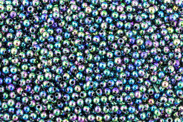 istock Colorful rainbow shiny beads texture background 1409302335