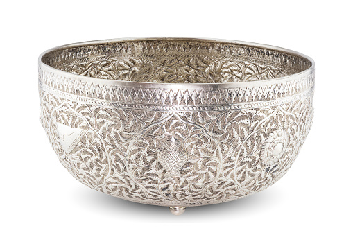 Antique sculptured silver Thai bowl on white background with clipping path