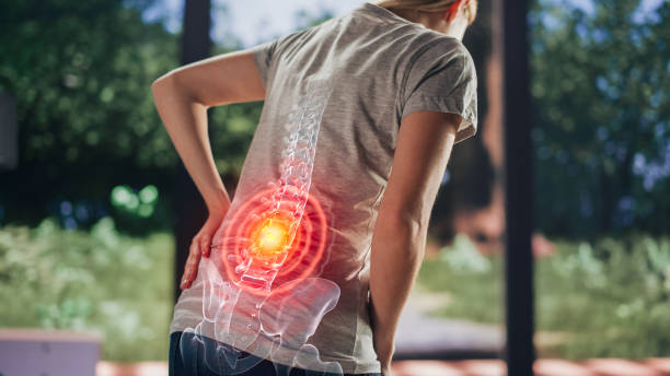 vfx back pain augmented reality render. close up of a female experiencing discomfort in a result of spine trauma or arthritis. massaging and stretching the back to ease the injury. - dor de costas imagens e fotografias de stock