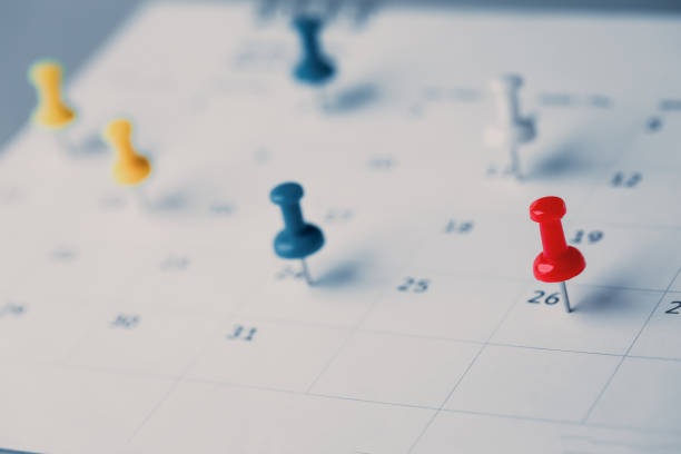 istock Embroidered red pins on a calendar event Planner calendar,clock to set timetable organize schedule,planning for business meeting or travel planning concept. 1409304191