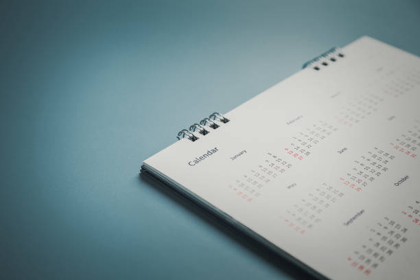 istock Embroidered red pins on a calendar event Planner calendar,clock to set timetable organize schedule,planning for business meeting or travel planning concept. 1409304200