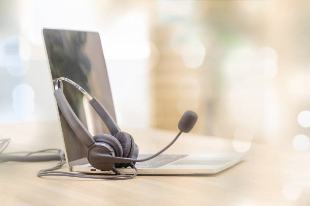 istock Headset and customer support equipment at call center service. 1409304255