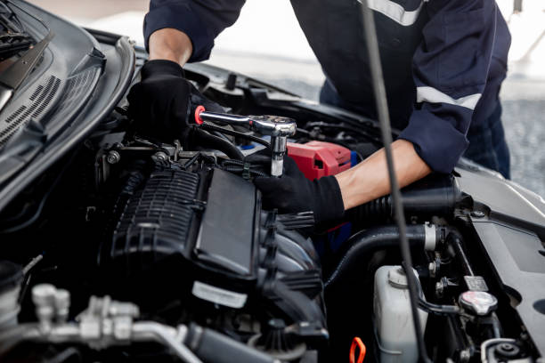 istock Car care maintenance and servicing, Close-up hand technician auto mechanic using the wrench to repairing change spare part car engine problem and insurance service support. 1409304280