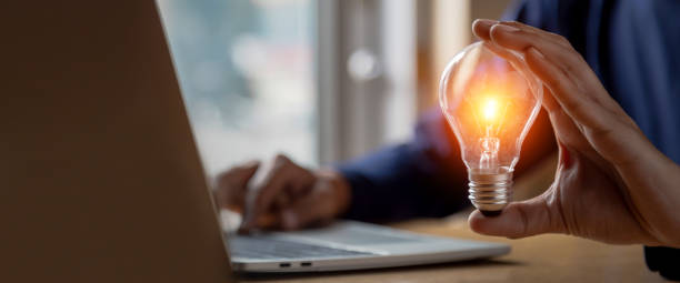 istock Close up hand choose light bulb or lamp with bright for human resources or leadership and creativity thinking idea motivation or vision and knowledge learning. 1409304355