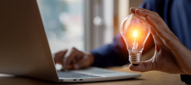 istock Close up hand choose light bulb or lamp with bright for human resources or leadership and creativity thinking idea motivation or vision and knowledge learning. 1409304360