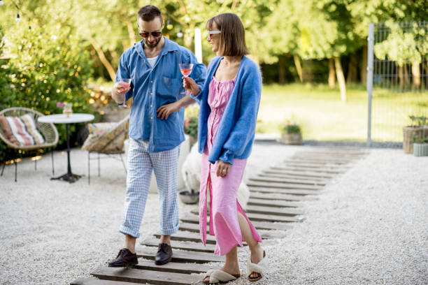 istock Stylish couple spend summer time at the backyard 1409305287