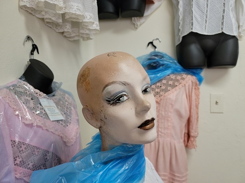 cute female mannequin face and lace fabric clothing