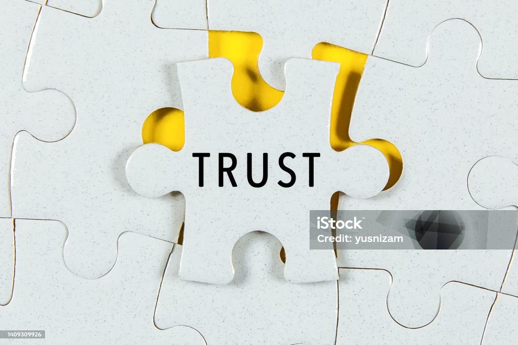 Trust word on a Jigsaw Puzzle Trust Stock Photo