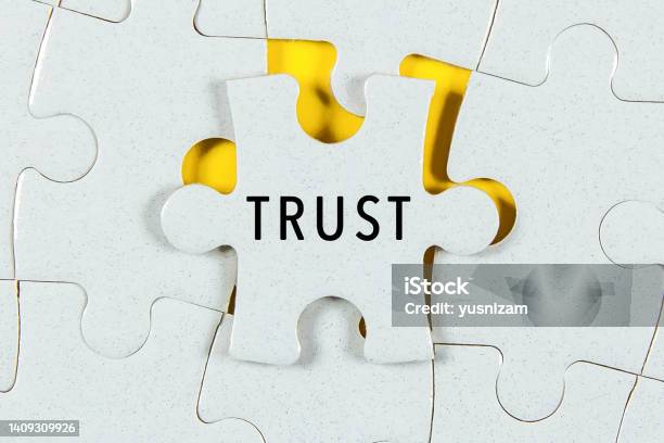 Trust Word On A Jigsaw Puzzle Stock Photo - Download Image Now - Trust, Choosing, Achievement