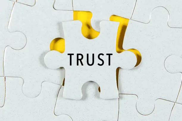 Photo of Trust word on a Jigsaw Puzzle