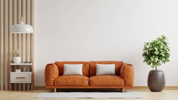 White wall interior living room have orange leather sofa and decoration minimal.