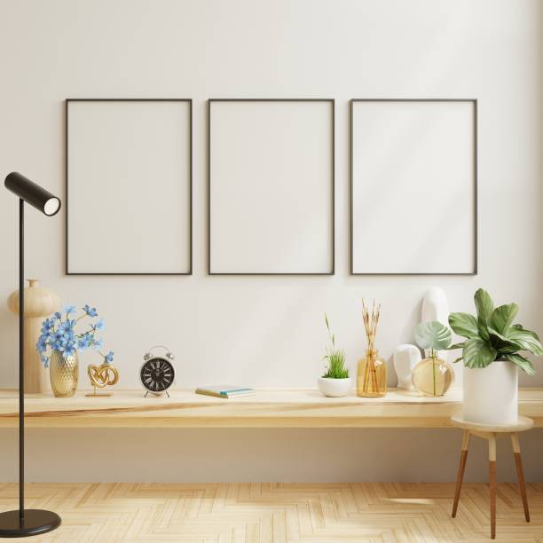 istock Mockup black poster frame on wooden shelf in modern interior background. 1409310768