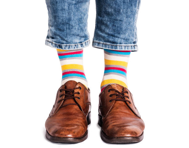 istock Men's legs, trendy shoes and bright socks 1409310906