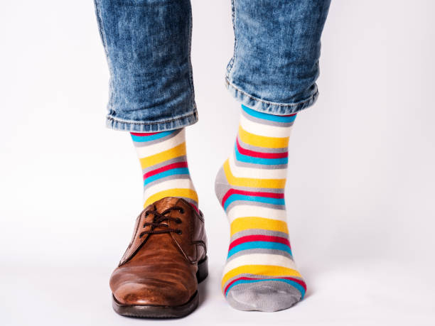 istock Men's legs, trendy shoes and bright socks 1409310934