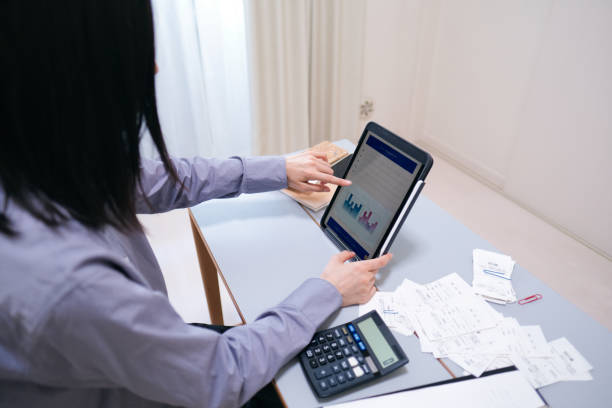 istock Woman checking personal financial records with internet 1409311277