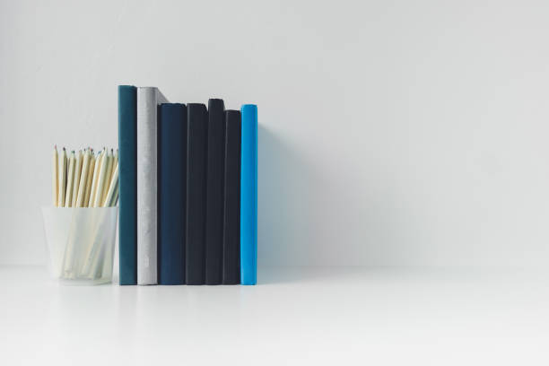 istock Book or textbook stack with pencil with copy space. Businessperson working or student reading and writingI. Idea of success in business learning course or education studying. 1409312144
