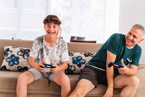 istock Father And Son Competing In Video Games At Home 1409313736