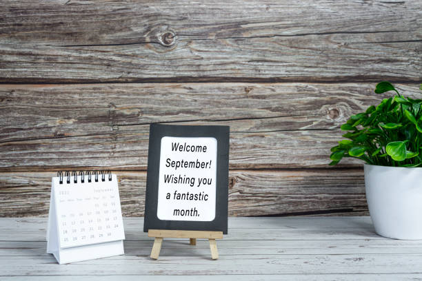 istock Motivational quotes on paper frame with September 2022 calendar. 1409314804