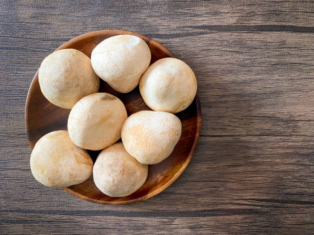istock Straw mushroom in the wooden plate 1409314987