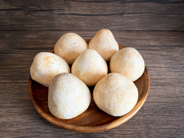 istock Straw mushroom in the wooden plate 1409314993