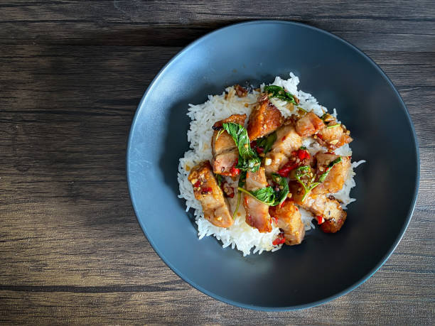 istock Rice topped with crispy pork belly with Thai basil 1409314995