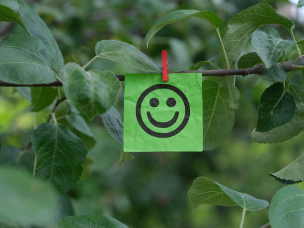 Symbol of a smile drawn on a tree. Background