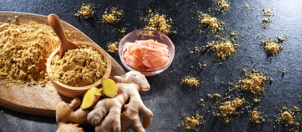 istock Bowls with marinated and ground ginger and its fresh rhizome 1409315953
