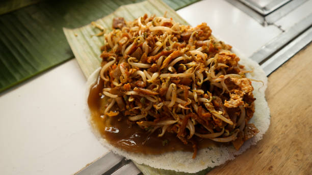 istock Fresh Fresh from the frying pan, Indonesian wet spring rolls 1409316091