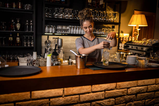 istock Woman bartender making cocktails in a bar 1409318697