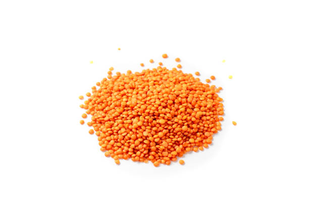 istock Dry red lentils on a white background isolate. Red lentil grits 1409318916