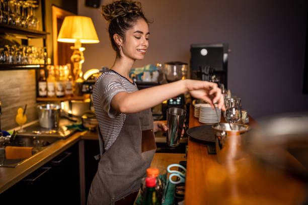 istock Woman bartender making cocktails in a bar 1409318952