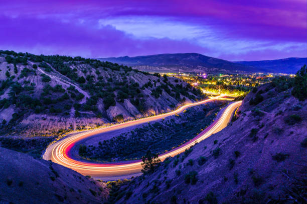 istock Mountain Road Curve at Night with Light Trails Long Exposure 1409321188