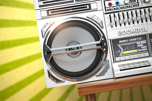 Retro ghetto blaster boombox, radio and audio tape recorder on vintage background. 3d illustration