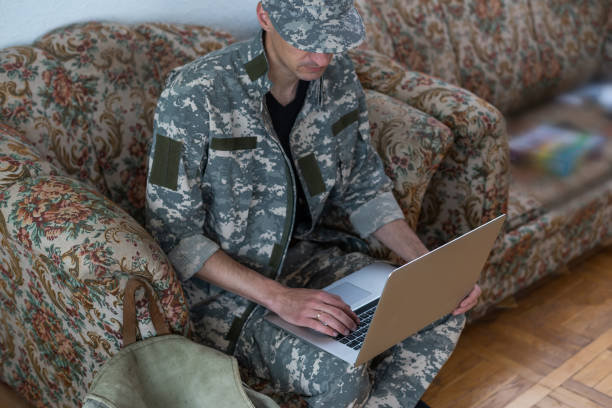 istock Soldier holding laptop. Military education concept 1409331188
