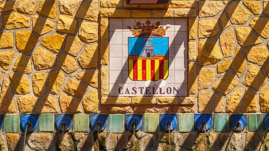 Tiles with the shield of Castellón de la Plana in Spain with water jets or fountain under the shield
