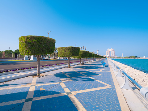 Perspective view of the Abu Dhabi Corniche promenade with view to Marina island.