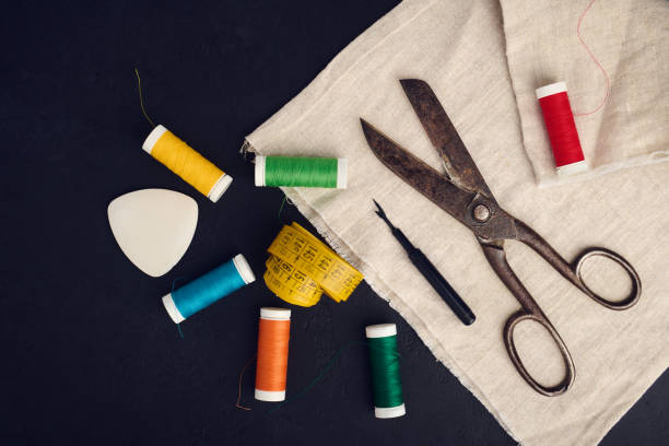 istock Old scissors, spools of colored thread, centimeter and tailors chalk, flat lay 1409335026