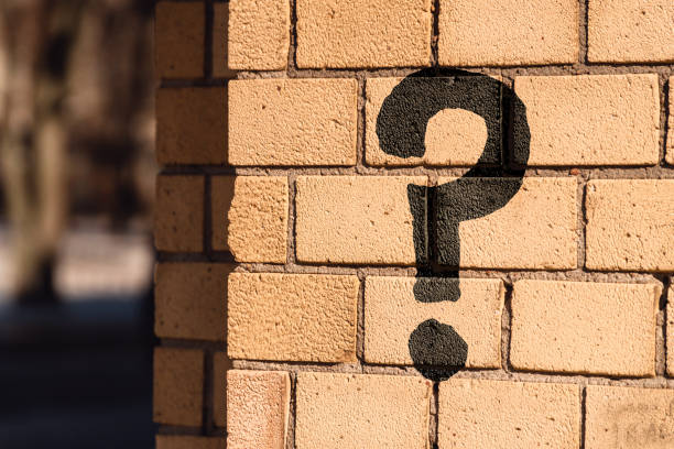 istock Question mark concept or FAQ. The sign is painted on a brick wall 1409339002
