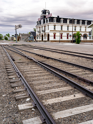 Dillon, Montana, USA –June 19, 2022: Along the rail tracks in Dillon Montana hotel and crossing lights