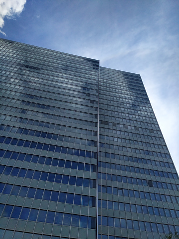 Top of a building with deep blue sky.