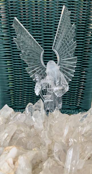 istock Crystal rain bath: angel and large clear quartz cluster 1409343395