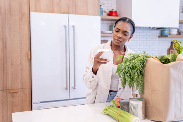 istock Woman Puzzled Reviewing Her Grocery Bill 1409344163