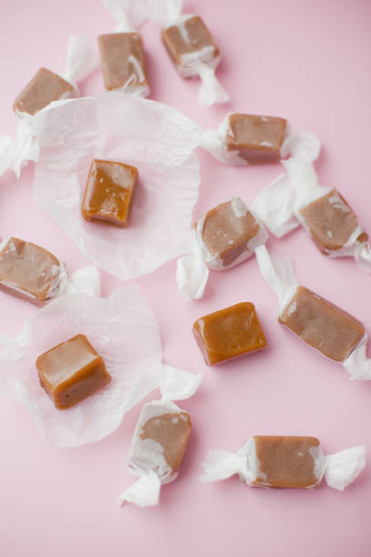 istock Caramel candy fudge in paper wrapping 1409344525