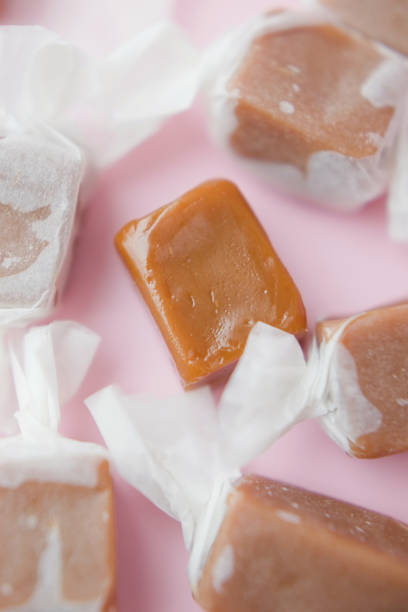 istock Caramel candy fudge in paper wrapping 1409344561