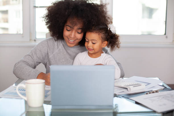 istock Young mother working and spending time with her daughter 1409344731