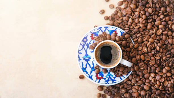 istock Turkish coffee pot of coffee beans with coffee cup aon linen table 1409348727