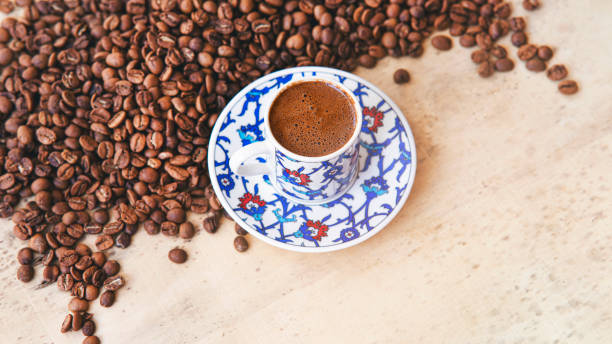 istock Turkish coffee pot of coffee beans with coffee cup aon linen table 1409348801