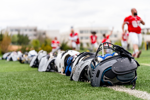 American football  helmets on the grass of football arena or stadium
