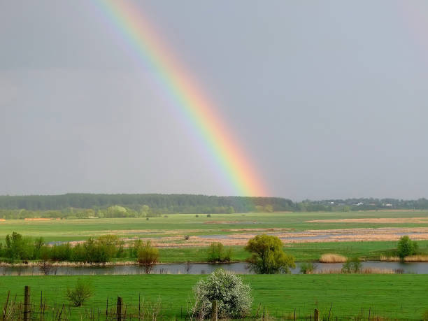 istock Rainbow over the river valley in Ukraine. Summer landscape 1409352736
