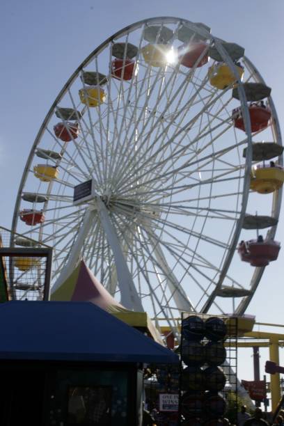 istock Ferris wheel against a blue sky 1409352762